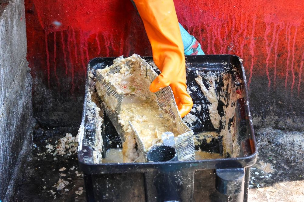Grease Trap Cleaning Olympia Fields IL – grease-laden baffle basket lifted from a trap at an Olympia Fields kitchen